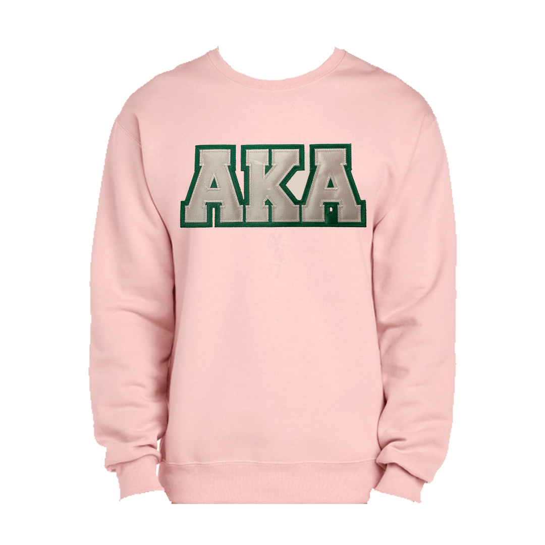 Pink sweatshirt with embroidered green-bordered AKA letters, perfect for sorority and fraternity greek gear enthusiasts.