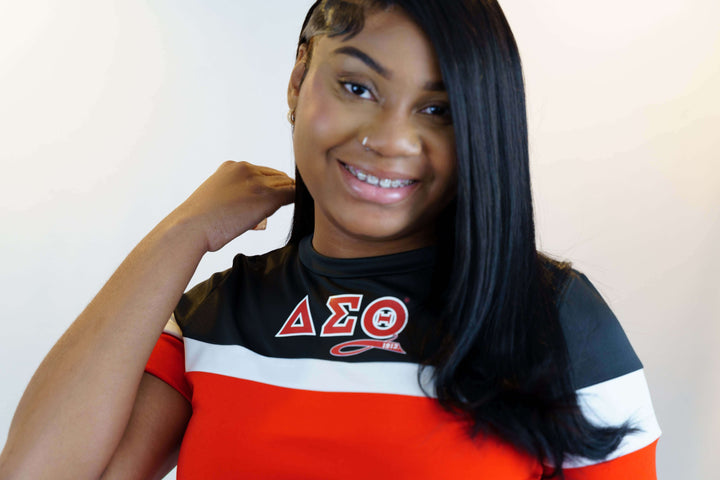 Stylish woman in Delta Sigma Theta color block short set, showcasing sorority pride and trendy greek gear.