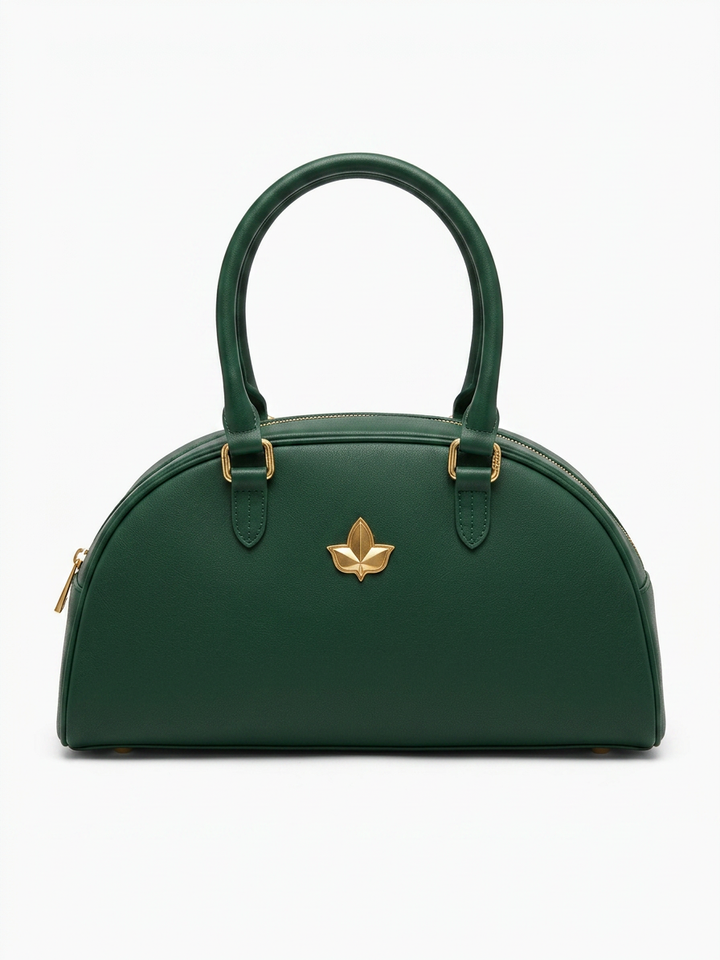 Front view of A&W Heritage Mini Bowler Bag in Ivy Green full-grain leather with brushed gold hardware and structured silhouette