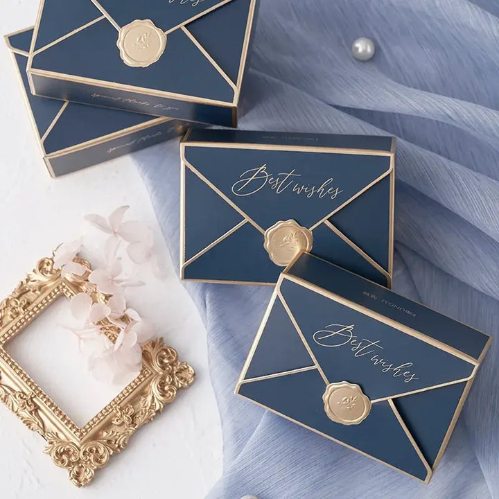 Sorority-inspired candy boxes in navy blue with gold accents, perfect for sharing sweet treats with sisters.