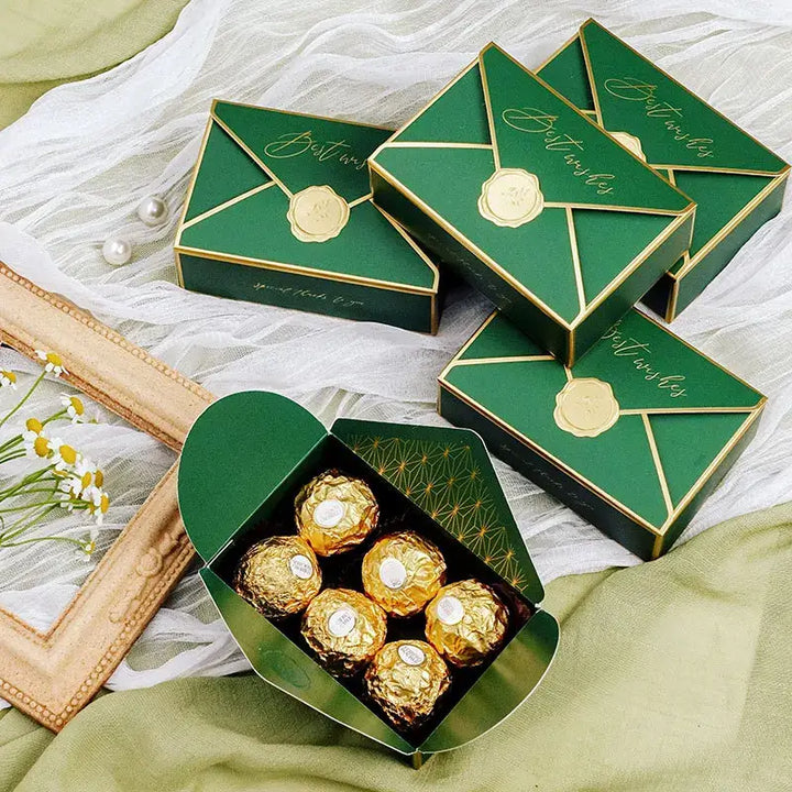 Sorority-inspired candy box featuring elegantly designed green packaging with golden treats inside, perfect for sharing.