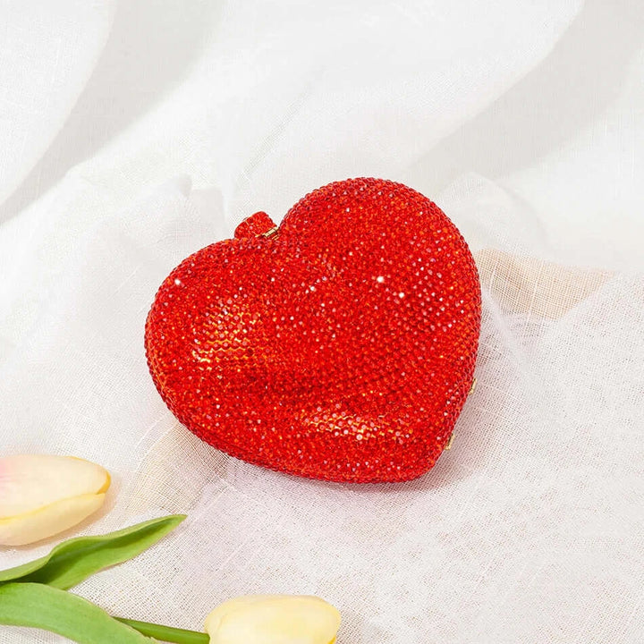 Stunning red heart-shaped crystal clutch bag, perfect for sorority and fraternity events, adding glam to any outfit.
