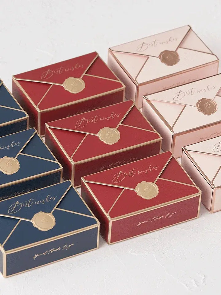 Sorority-inspired candy boxes in navy, red, and pink with elegant "Best Wishes" design and wax seal accents.