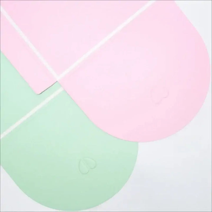 Pink and green gift boxes, perfect for sorority and fraternity paraphernalia, adding a stylish touch to your Greek gear gifts.