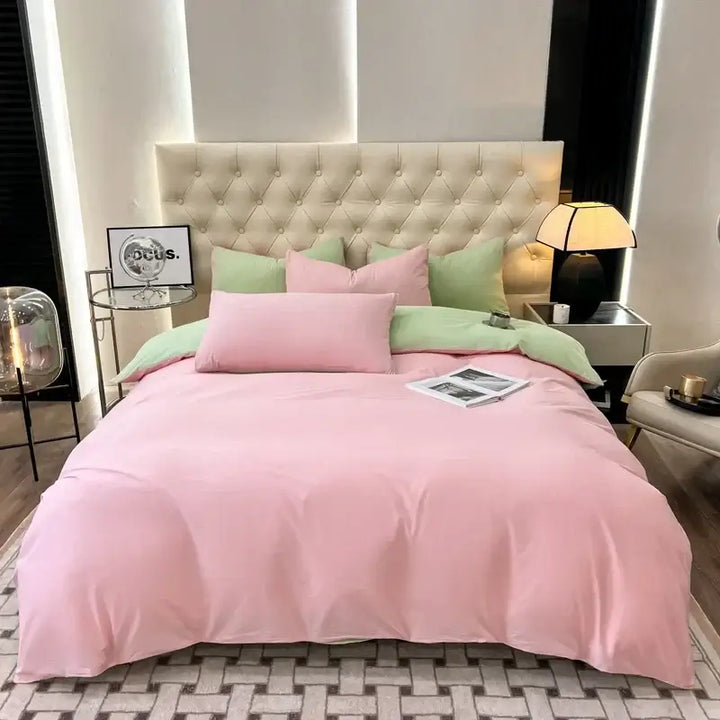 Luxurious pink and green duvet bedding set on a stylish bed, perfect for sorority and fraternity Greek gear.