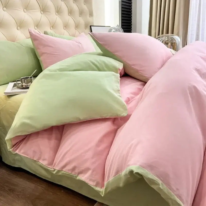 Luxurious pink and green duvet bedding set with pillows, perfect for sorority and fraternity Greek gear.