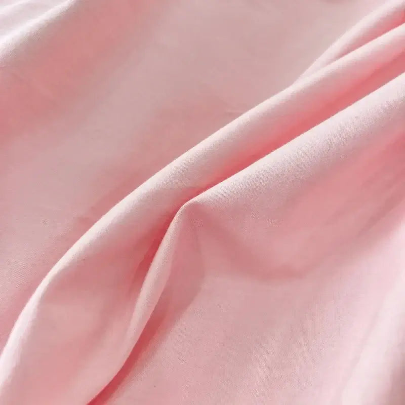 Soft pink fabric of the Pink Green duvet bedding set, showcasing its luxurious texture and comfort.