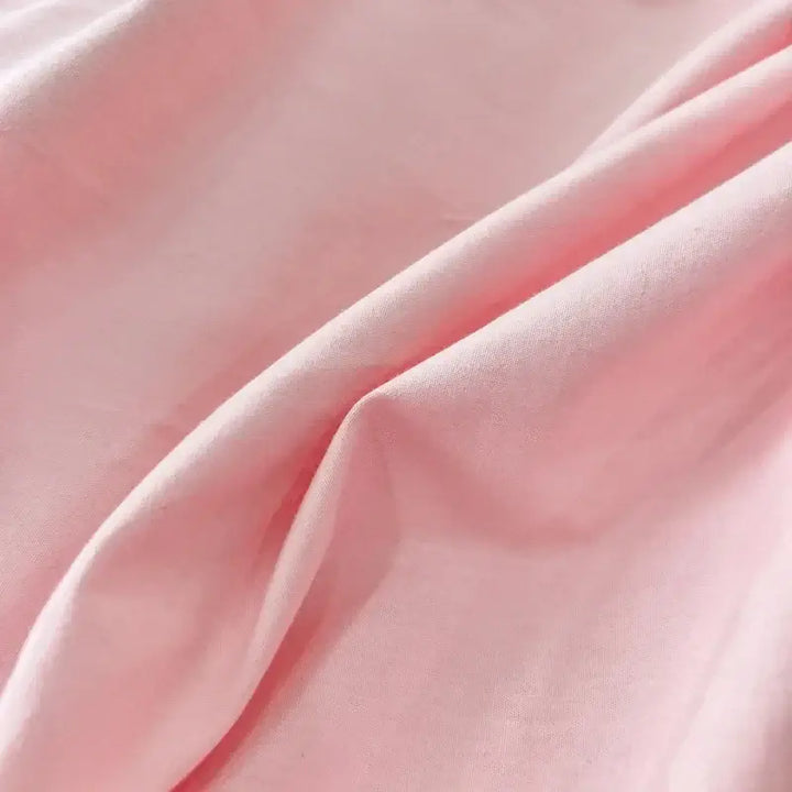 Soft pink fabric of the Pink Green duvet bedding set, showcasing its luxurious texture and comfort.