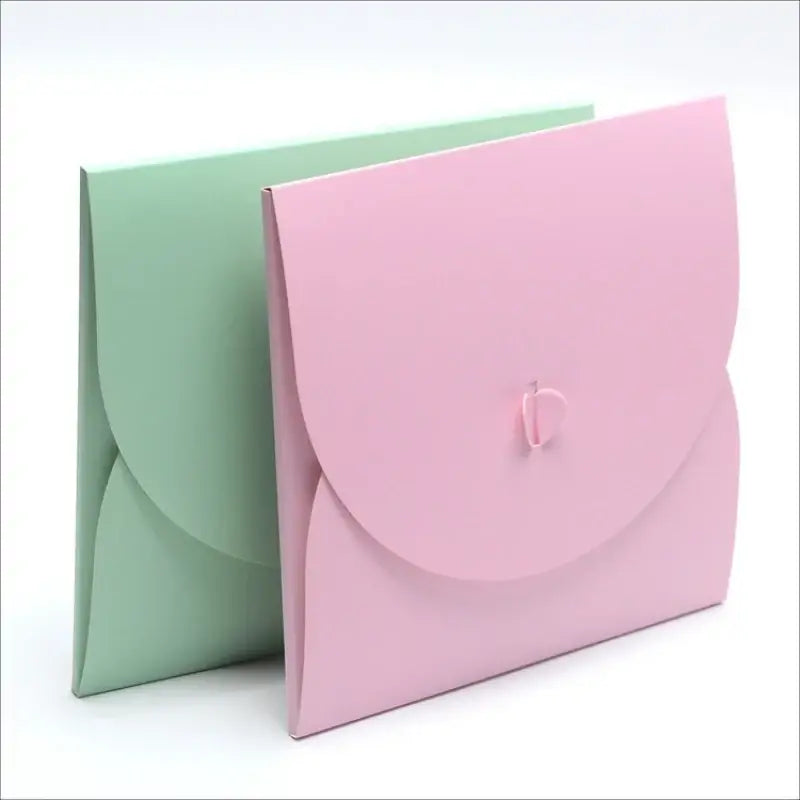Pink and green gift boxes, perfect for sorority and fraternity events, offering stylish greek gear paraphernalia.