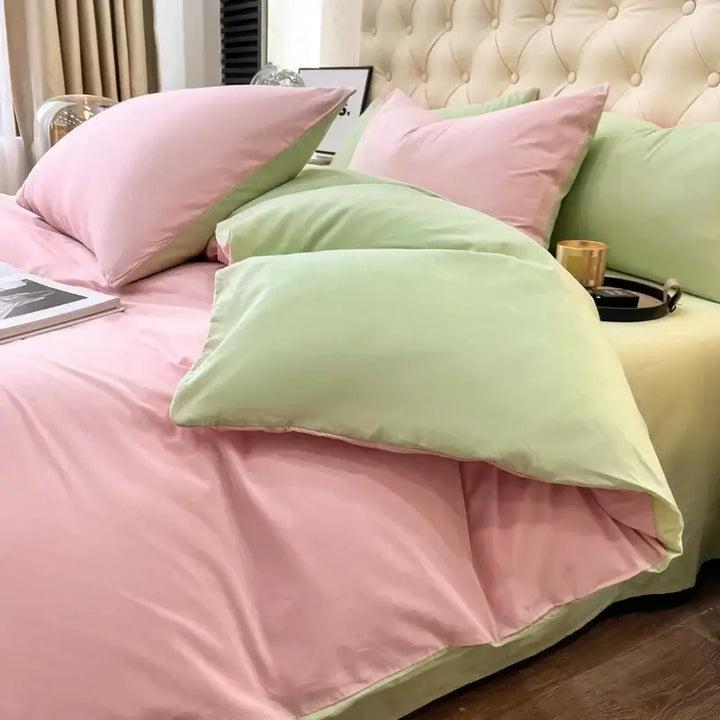 Luxurious pink and green duvet bedding set on a stylish bed, perfect for sorority and fraternity decor.