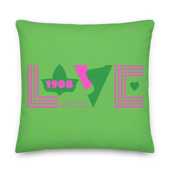Bright green pillow with pink "LOVE" design and Greek letters, perfect for sorority and fraternity paraphernalia.