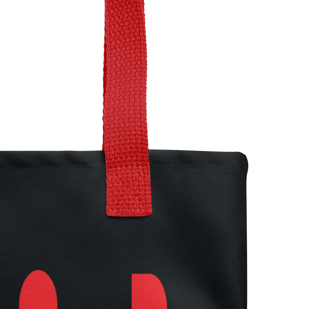 Close-up of the red handle on a Delta Custom Soror Tote Bag, showcasing durable construction and vibrant colors for sorority paraphernalia.