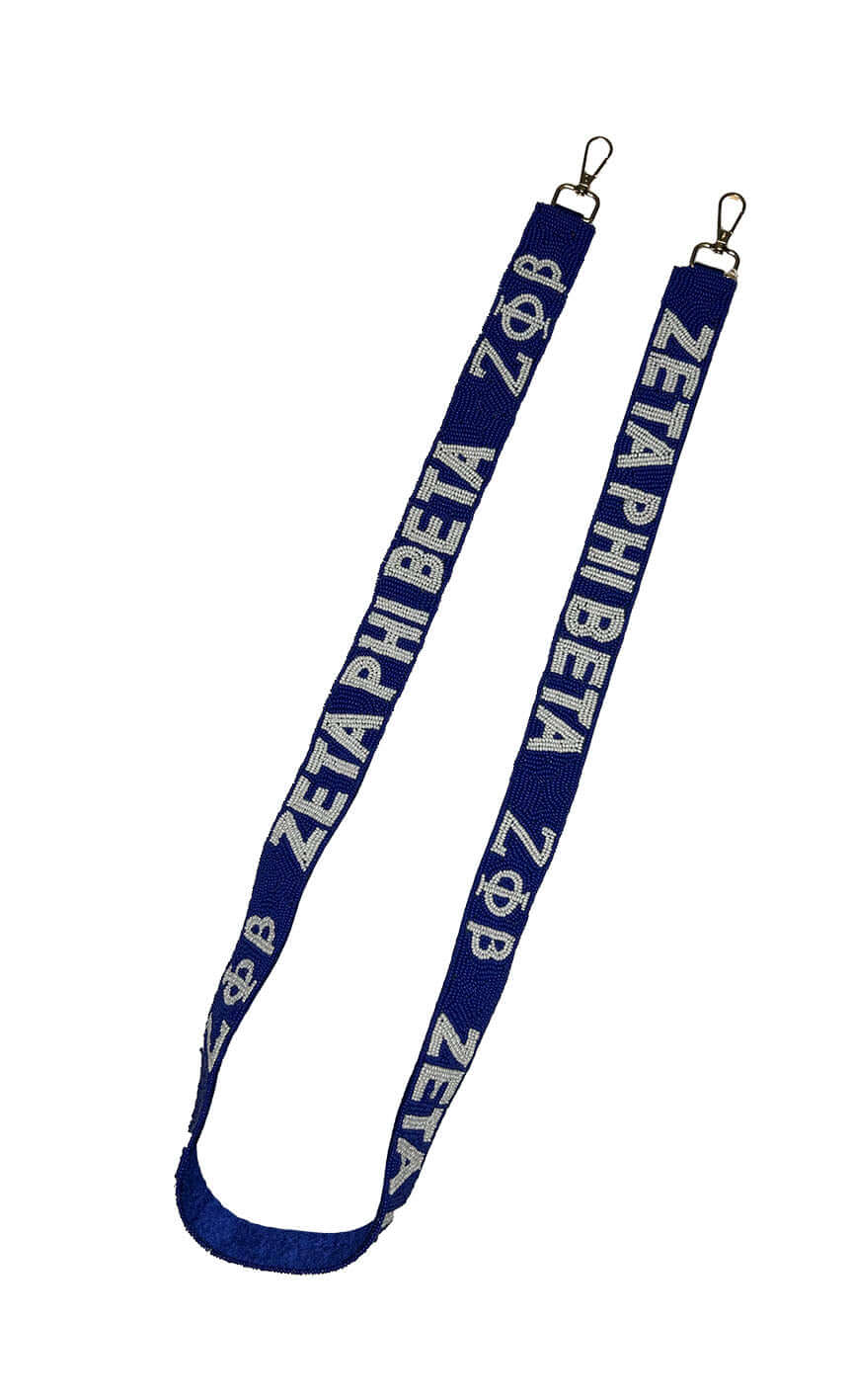 Hand-beaded Zeta Purse Strap in blue and white, perfect Greek gear for sororities and fraternities, measuring 48 inches long.