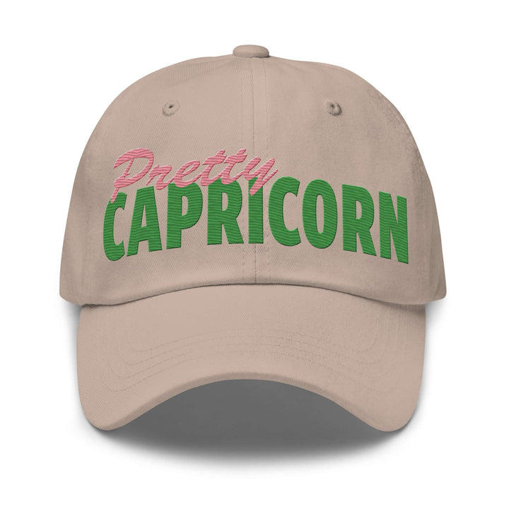 Pretty Capricorn hat in beige, vibrant green and pink lettering, perfect for sorority and fraternity paraphernalia.