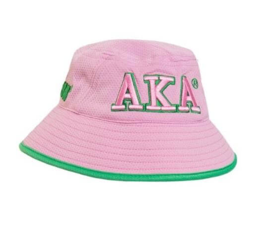 Stylish AKA bucket hat in pink with green trim, perfect sorority paraphernalia for proud Alpha Kappa Alpha sisters.