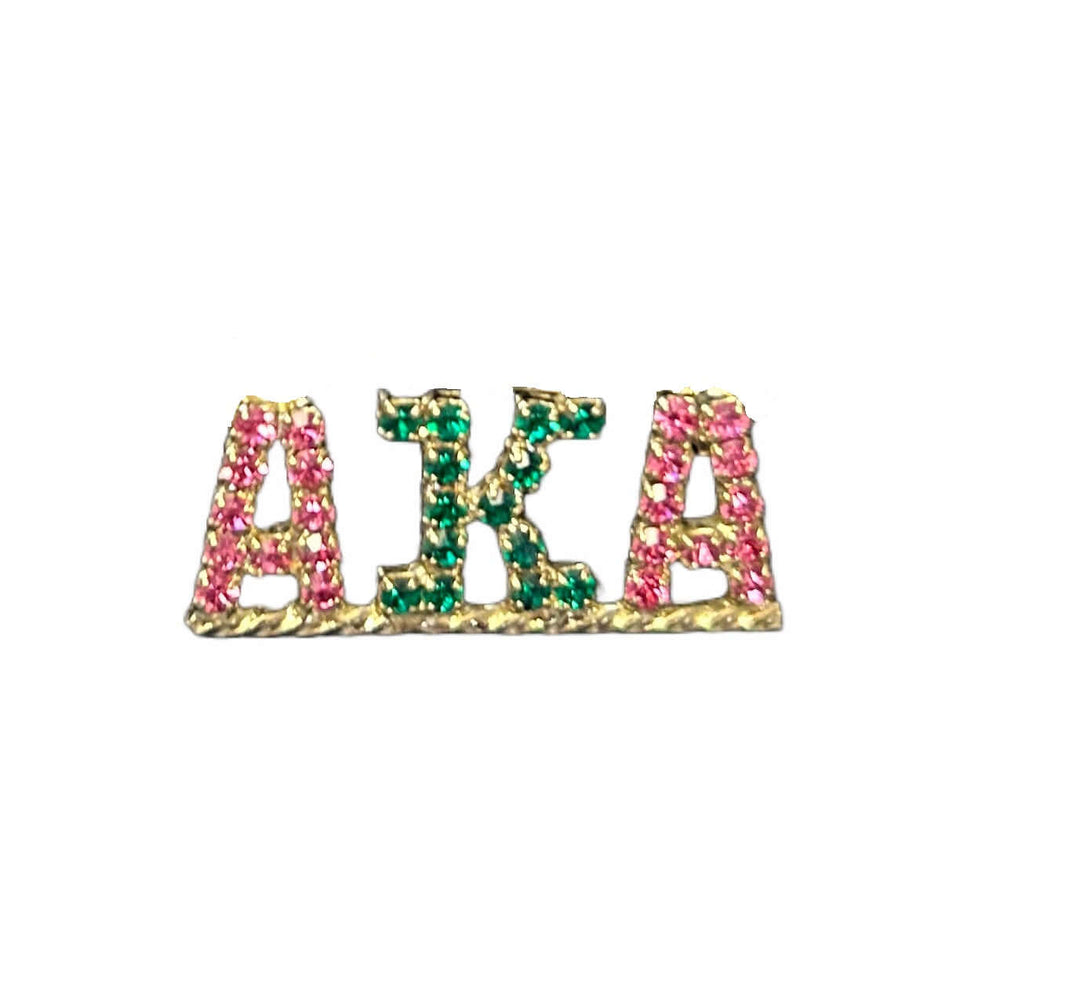 AKA rhinestone pin featuring vibrant green and pink crystals, perfect sorority paraphernalia and Greek gear.