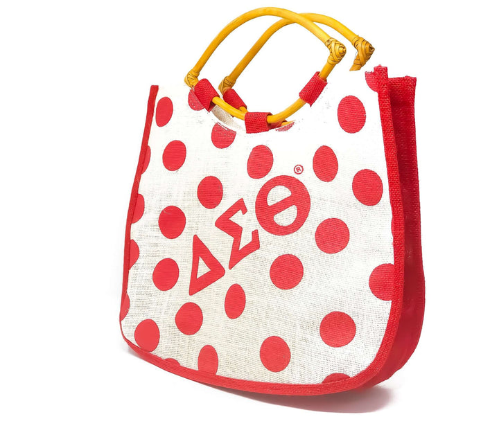 Delta Bag with red polka dots and yellow handles, perfect for sorority and fraternity gear or everyday use.