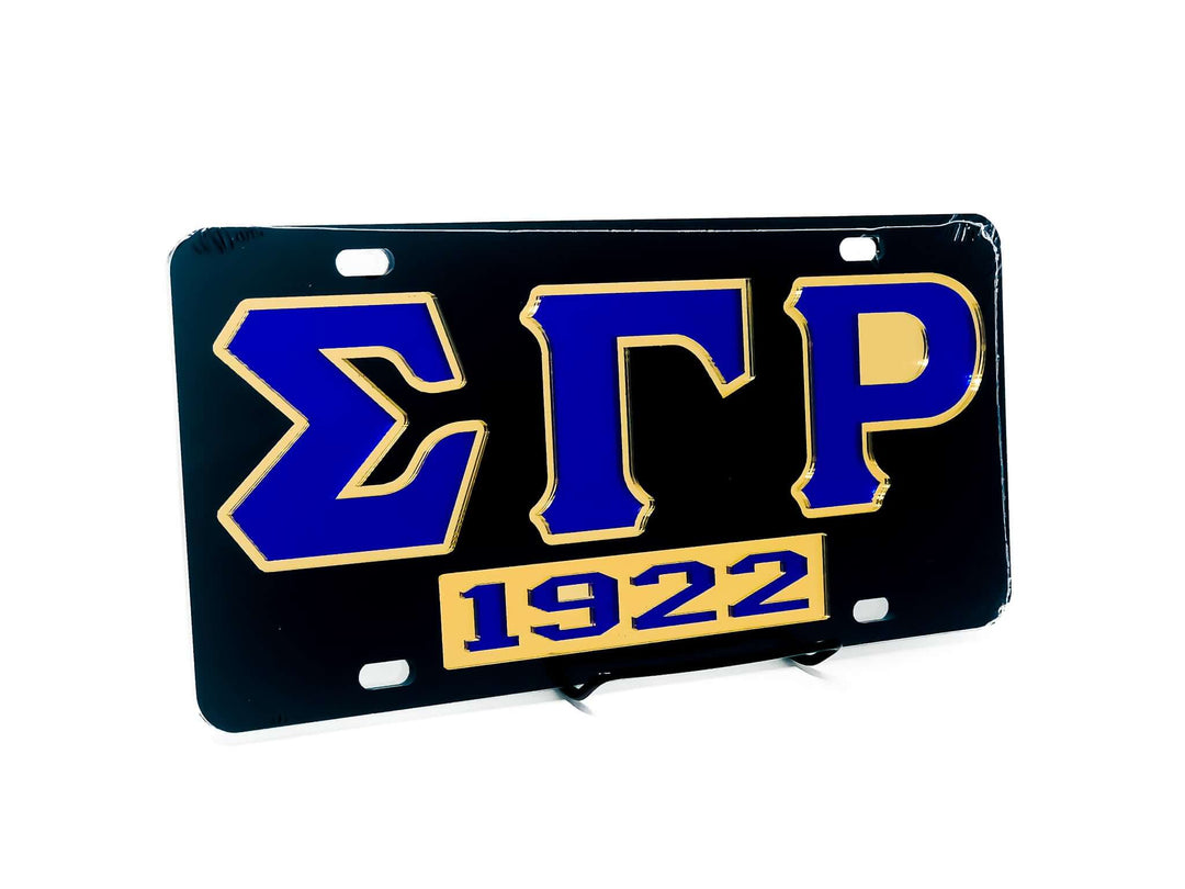 SGRho Car Tag featuring black background and gold lettering, perfect sorority paraphernalia and Greek gear for proud members.