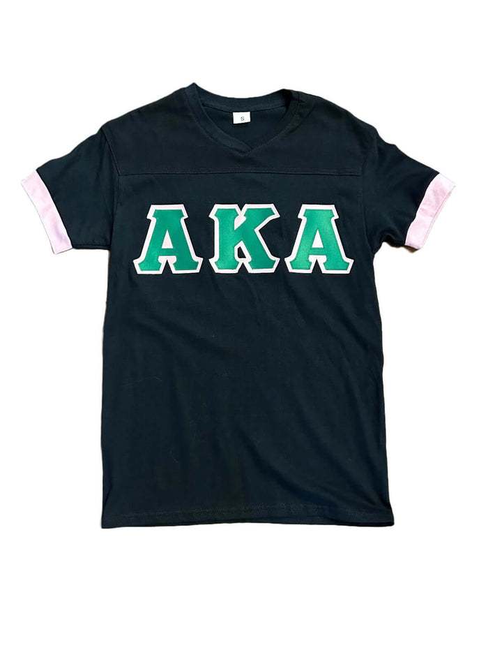 Classic black AKA t-shirt with green letters and pink trim, perfect Greek gear for sorority and fraternity paraphernalia.