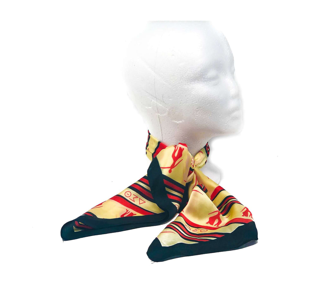 Delta Scarf displayed on a mannequin, featuring vibrant colors and iconic Delta Sigma Theta symbols, perfect for sorority members.