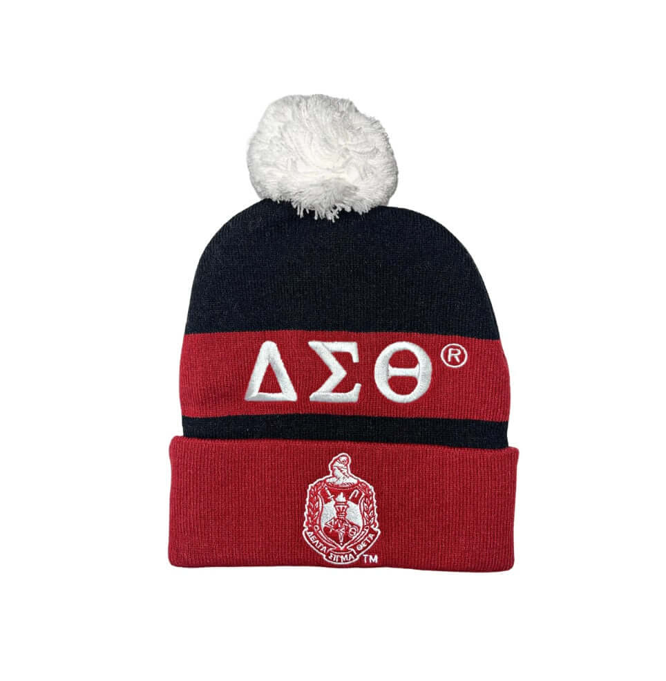 Delta Sigma Theta knit beanie with pom-pom, featuring Greek letters and sorority emblem, perfect for winter and Greek paraphernalia.