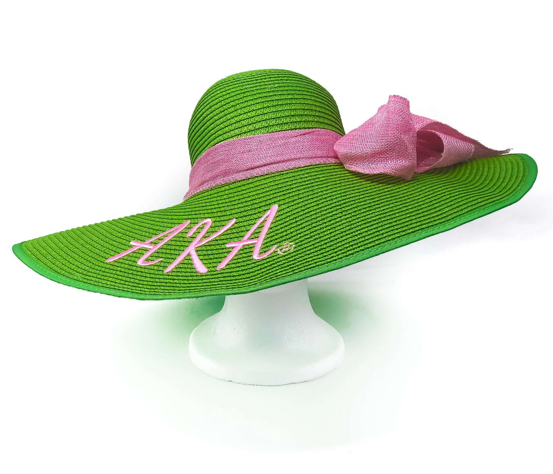 AKA Fashion Sun Hat in vibrant green with pink ribbon, perfect sorority paraphernalia for stylish summer outings.