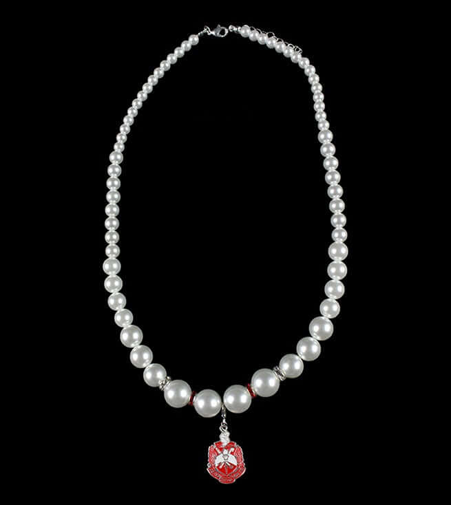 Delta Pearl Collection necklace featuring pearls and a red sorority pendant, perfect Greek gear for fraternity and sorority events.