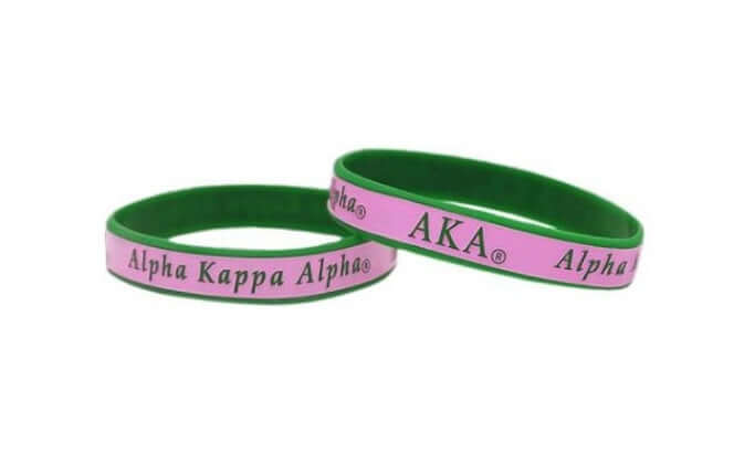 Silicone wristbands featuring AKA, Alpha Kappa Alpha, in sorority colors for Greek life and sorority paraphernalia.