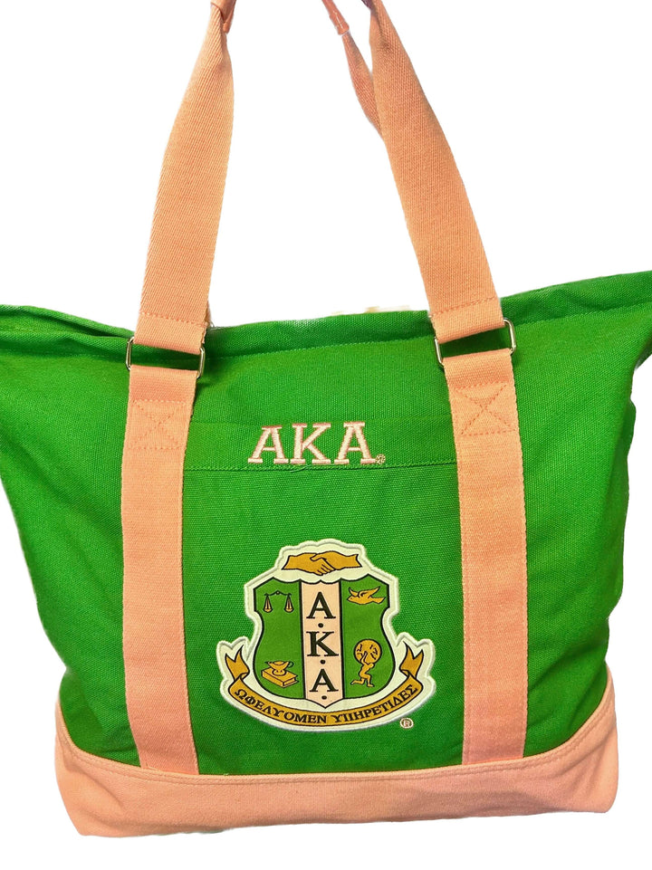 AKA Canvas Tote Bag in green with pink straps showcasing Sorority symbol, ideal for Greek gear and everyday use.