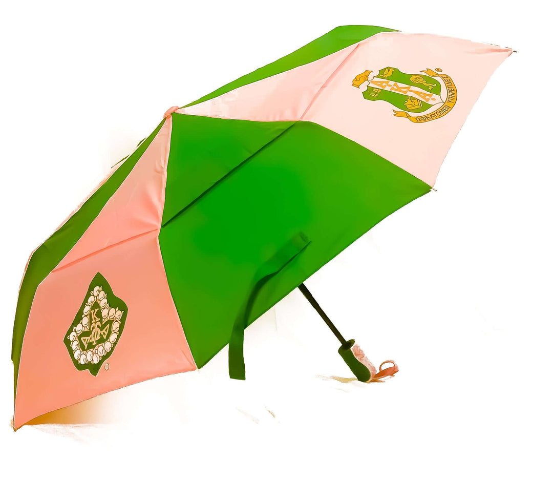 AKA Tote Umbrella showcasing pink and green design with AKA emblem, perfect sorority gear for protection and pride.