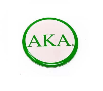 Round retro AKA button with a pink background and green letters, perfect for sorority and fraternity paraphernalia.