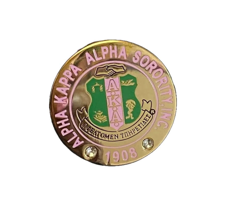 Round gold AKA pin with rhinestones, featuring pink and green crest - perfect sorority paraphernalia and Greek gear.