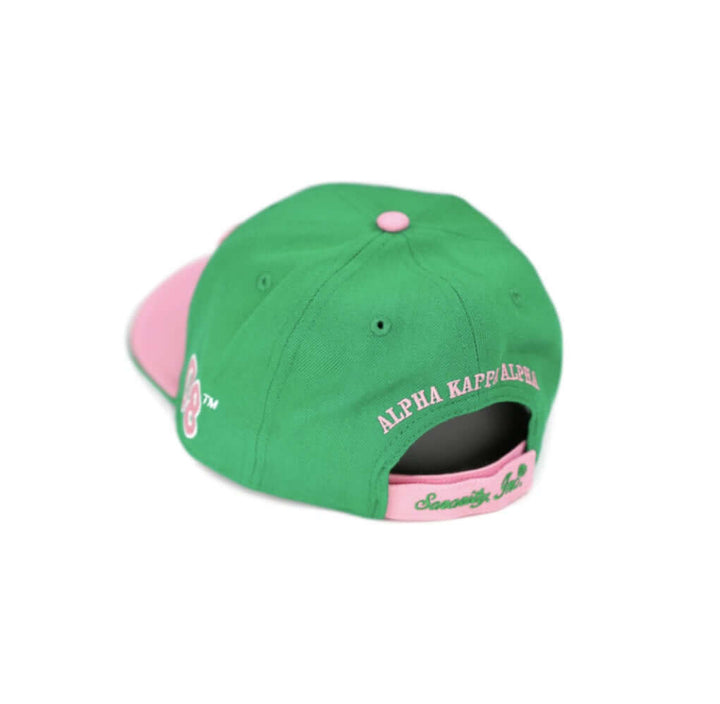 Green and pink Alpha Kappa Alpha symbol hat showcasing sorority pride and Greek gear style. Perfect for paraphernalia enthusiasts.