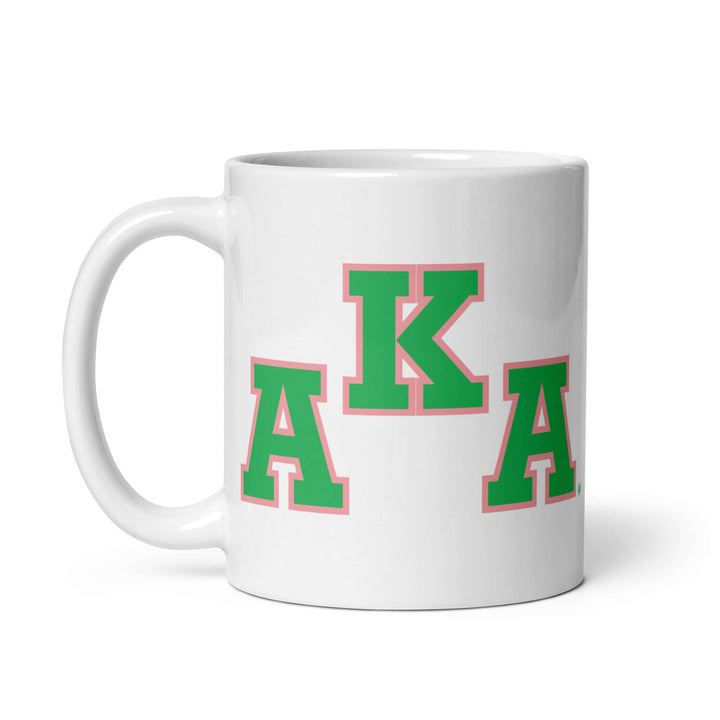 AKA Symbol Coffee Mug featuring Greek letters in green and pink, perfect for sorority paraphernalia and Greek gear enthusiasts.