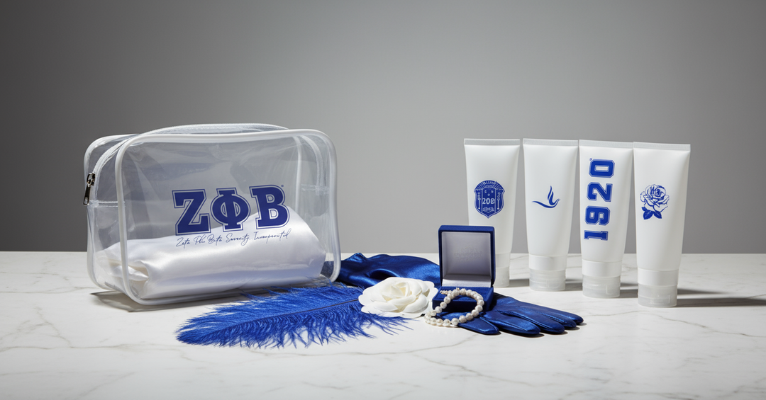 Zeta Phi Beta clear cosmetic travel set styled with pearls, gloves, feather, and sorority accessories by A&W Greek Shop.